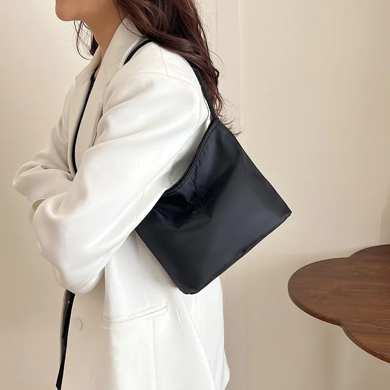 minimalist nylon armpit bag — korean niche embroidered letter bucket bag (hand held & underarm) minimalist nylon armpit bag — korean niche embroidered letter bucket bag (hand held & underarm)